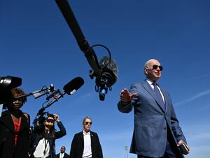 US President Joe Biden speaks to the press before boarding Air Force One, as he departs for Northern Ireland, at Joint Base Andrews in Maryland on April 11, 2023. (Photo by Jim WATSON / AFP)