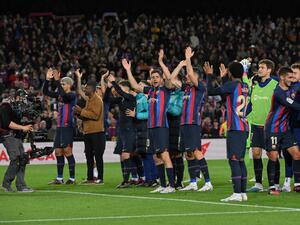 Barcelona's players celebrate at the end of the Spanish league football match between FC Barcelona and Real Madrid CF at the Camp Nou stadium in Barcelona on March 19, 2023. (Photo by LLUIS GENE / AFP)