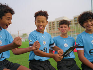 e& and manchester city surprise talented player programme participants with opportunity of a lifetime