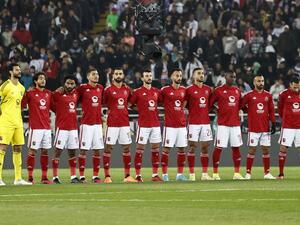 Ahly's players observe a minute of silence for the victims of the massive earthquake that struck Turkey and Syria two days ago, ahead of the FIFA Club World Cup semi-final football match between Egypt's Al-Ahly and Spain's Real Madrid at the Prince Moulay Abdellah Stadium in Rabat on February 8, 2023. (Photo by Khaled DESOUKI / AFP)