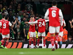 Arsenal's Swiss midfielder Granit Xhaka (C) celebrates scoring the opening goal during the UEFA Europa League round of 16, second-leg football match between Arsenal and Sporting Lisbon at the Emirates Stadium in London on March 16, 2023. (Photo by Glyn KIRK / AFP)