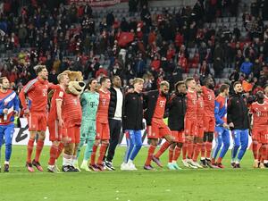 Bayern Munich's team celebrates after the German first division Bundesliga football match between FC Bayern Munich and BVB Borussia Dortmund in Munich, southern Germany, on April 1, 2023. (Photo by KERSTIN JOENSSON / AFP)