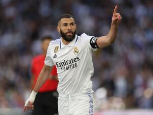 Real Madrid's French forward Karim Benzema celebrates scoring a goal during the Spanish league football match between Real Madrid CF and Real Valladolid FC at the Santiago Bernabeu stadium in Madrid on April 2, 2023. (Photo by Thomas COEX / AFP)