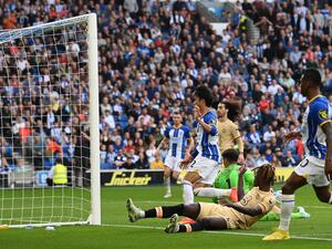 Chelsea's English defender Trevoh Chalobah (2R) scored an own goal, and Brighton's third, after Brighton's Ecuadrorian defender Pervis Estupinan (R) crossed the ball during the English Premier League football match between Brighton and Hove Albion and Chelsea at the American Express Community Stadium in Brighton, southern England on October 29, 2022. (Photo by Glyn KIRK / AFP)