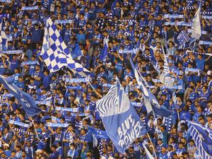 Fans of Al-Hilal cheer during the Saudi Pro League football match between Al-Hilal and Al-Nassr at the Prince Faisal Bin Fahd stadium in the capital Riyadh on April 18, 2023. (Photo by Fayez Nureldine / AFP)