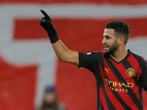 Manchester City's Algerian midfielder Riyad Mahrez celebrates scoring the opening goal during the UEFA Champions League round of 16, first-leg football match between RB Leipzig and Manchester City in Leipzig, eastern Germany on February 22, 2023. (Photo by Odd ANDERSEN / AFP)