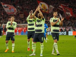 Manchester City's player including German midfielder Ilkay Gundogan (C) after the UEFA Champions League quarter-final, second leg football match between Bayern Munich and Manchester City in Munich, southern Germany on April 19, 2023. (Photo by Odd ANDERSEN / AFP)
