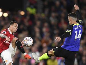 Manchester United's Brazilian midfielder Antony (L) fights for the ball with Tottenham Hotspur's Croatian midfielder Ivan Perisic (R) during the English Premier League football match between Manchester United and Tottenham Hotspur at Old Trafford in Manchester, north west England, on October 19, 2022. (Photo by Oli SCARFF / AFP)