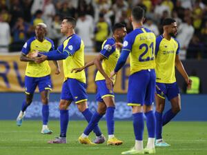 Nassr's players celebrate scoring during the Saudi Pro League football match between Abha and al-Nassr at Mrsool Park Stadium in Riyadh on March 18, 2023. (Photo by Fayez NURELDINE / AFP)