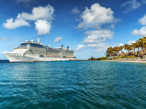 WILLEMSTAD, CURACAO - APRIL 10, 2018: View from infinity pool with beach on Cruise ship Celebrity Eclipse docked at port Willemstad.