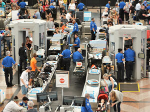 Denver, CO, USA. July 27, 2019. Travelers in long lines at Denver International Airport going thru the Transportation Security Administrations (TSA) security screening areas to get to their flights.