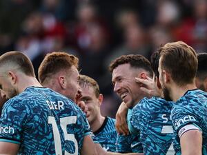 Tottenham Hotspur's Croatian midfielder Ivan Perisic (C) celebrates with teammates after scoring his team third goal during the English Premier League football match between Southampton and Tottenham Hotspur at St Mary's Stadium in Southampton, southern England on March 18, 2023. (Photo by Adrian DENNIS / AFP) 