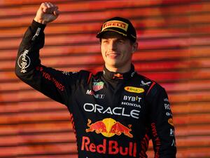 Red Bull Racing's Dutch driver Max Verstappen celebrates victory on the podium after the 2023 Formula One Australian Grand Prix at the Albert Park Circuit in Melbourne on April 2, 2023. (Photo by Martin KEEP / AFP)
