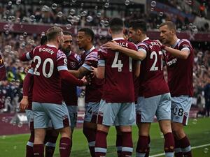 West Ham United's Algerian midfielder Said Benrahma celebrates with teammates after scoring their first goal from the penalty spot during the English Premier League football match between West Ham United and Aston Villa at the London Stadium, in London on March 12, 2023. (Photo by Ben Stansall / AFP)