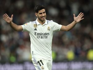 Real Madrid's Spanish midfielder Marco Asensio celebrates scoring his team's first goal during the Spanish league football match between Real Madrid CF and Getafe CF at the Santiago Bernabeu stadium in Madrid on May 13, 2023. (Photo by Thomas COEX / AFP)