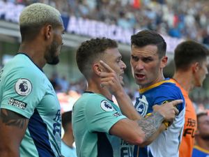 Brighton's Dutch defender Joel Veltman (R) clashes with Newcastle United's Brazilian striker Joelinton (L) during the English Premier League football match between Brighton and Hove Albion and Newcastle United at the American Express Community Stadium in Brighton, southern England on August 13, 2022. (Photo by Glyn KIRK / AFP) 