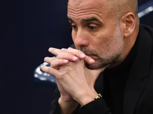 Manchester City's Spanish manager Pep Guardiola reacts ahead of the UEFA Champions League second leg semi-final football match between Manchester City and Real Madrid at the Etihad Stadium in Manchester, north west England, on May 17, 2023. (Photo by Oli SCARFF / AFP)