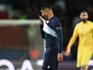 Paris Saint-Germain's Moroccan defender Achraf Hakimi leaves the pitch after receiving a red card during the French L1 football match between Paris Saint-Germain (PSG) and Ajaccio at the Parc des Princes in Paris, on May 13, 2023. (Photo by Anne-Christine POUJOULAT / AFP)
