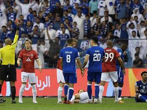 Hilal's Saudi midfielder Salem al-Dawsari (R) reacts upon receiving a red card during the first leg of AFC Champions League final between Saudi Arabia's Al-Hilal and Japan's Urawa Red Diamonds at the King Fahd International Stadium in Riyadh on April 29, 2023. (Photo by - / AFP)