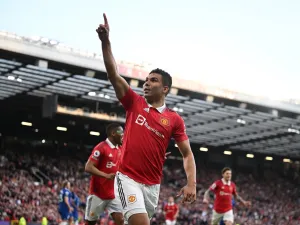 Manchester United's Brazilian midfielder Casemiro celebrates after scoring their opening goal during the English Premier League football match between Manchester United and Chelsea at Old Trafford in Manchester, north west England, on May 25, 2023. (Photo by Oli SCARFF / AFP)
