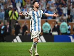 Argentina's forward #10 Lionel Messi celebrates scoring his penalty during the Qatar 2022 World Cup final football match between Argentina and France at Lusail Stadium in Lusail, north of Doha on December 18, 2022. (Photo by Anne-Christine POUJOULAT / AFP)