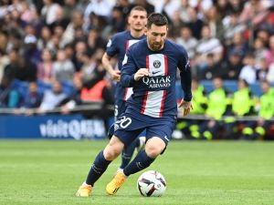 Paris Saint-Germain's Argentine forward Lionel Messi runs with the ball during the French L1 football match between Paris Saint-Germain (PSG) and FC Lorient at The Parc des Princes Stadium in Paris on April 30, 2023. (Photo by Alain JOCARD / AFP)