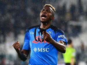 Napoli's Nigerian forward Victor Osimhen celebrates after winning in the Italian Serie A football match between Juventus and Napoli on April 23, 2023 at the Juventus stadium in Turin. (Photo by Isabella BONOTTO / AFP)