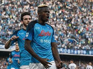 Napoli's Nigerian forward Victor Osimhen celebrates after scoring a penalty to open the scoring during the Italian Serie A football match between SSC Napoli and Fiorentina on May 7, 2023 at the Diego-Maradona stadium in Naples. Napoli makes their first appearance in front of their home fans on May 7 since becoming Italian champions for the first time since 1990 when they host Fiorentina. (Photo by Tiziana FABI / AFP)