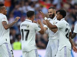 Real Madrid's French forward Karim Benzema (C) celebrates with teammates scoring his team's third goal during the Spanish league football match between Real Madrid CF and UD Almeria at the Santiago Bernabeu stadium in Madrid on April 29, 2023. (Photo by Thomas COEX / AFP)