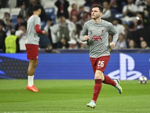 Liverpool's Scottish defender Andrew Robertson warms up ahead of the UEFA Champions League last 16 second leg football match between Real Madrid CF and Liverpool FC at the Santiago Bernabeu stadium in Madrid on March 15, 2023. (Photo by JAVIER SORIANO / AFP)