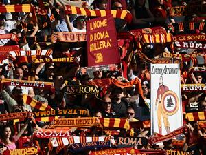 AS Rome fans cheer prior to the Italian Serie A football match between AS Rome and Inter Milan on May 6, 2023 at the Olympic stadium in Rome. (Photo by Vincenzo PINTO / AFP)