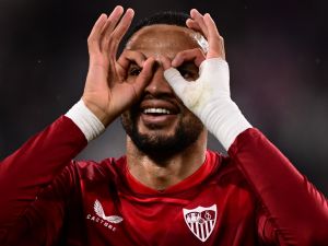 Sevilla's Moroccan forward Youssef En-Nesyri celebrates after opening the scoring during the UEFA Europa League semi-final first leg football match between Juventus and Sevilla on May 11, 2023 at the Juventus stadium in Turin. (Photo by Marco BERTORELLO / AFP)