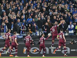 West Ham United's Brazilian midfielder Lucas Paqueta (2R) celebrates in front of the Gent fans after scoring their second goal from the penalty spot during the UEFA Europa Conference League second-leg quarter final football match between West Ham United and Gent at the London Stadium in east London on April 20, 2023. (Photo by Glyn KIRK / AFP)