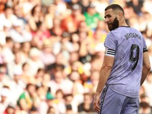 Real Madrid's French forward Karim Benzema looks backwards during the Spanish league football match between Valencia CF and Real Madrid CF at the Mestalla stadium in Valencia on May 21, 2023. (Photo by JOSE JORDAN / AFP)