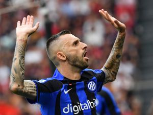 Inter Milan's Croatian midfielder Marcelo Brozovic celebrates scoring his team's first goal during the Italian Serie A football match between AC Milan and Inter Milan at the San Siro stadium in Milan on September 3, 2022. (Photo by Isabella BONOTTO / AFP)