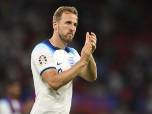 England's striker Harry Kane applauds fans on the pitch after the UEFA Euro 2024 group C qualification football match between England and North Macedonia at Old Trafford in Manchester, north west England, on June 19, 2023. England won the game 7-0. (Photo by Oli SCARFF / AFP)