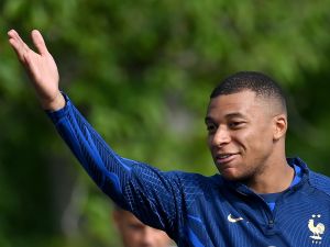 France's forward Kylian Mbappe gestures before a training session ahead of the upcoming UEFA Euro 2024 football tournament qualifying matches in Clairefontaine-en-Yvelines, on June 12, 2023. France will play against Gibraltar on June 16, 2023 and against Greece on June 19, 2023 in their UEFA Euro 2024 Group B Qualification matches. (Photo by FRANCK FIFE / AFP)