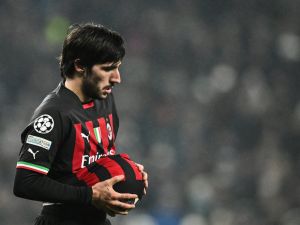 AC Milan's Italian midfielder Sandro Tonali cleans the ball during the UEFA Champions League round of 16 second-leg football match between Tottenham Hotspur and Milan AC at Tottenham Hotspur Stadium in London on March 8, 2023. (Photo by JUSTIN TALLIS / AFP)