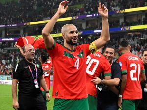 Morocco's midfielder #04 Sofyan Amrabat celebrates after winning the Qatar 2022 World Cup quarter-final football match between Morocco and Portugal at the Al-Thumama Stadium in Doha on December 10, 2022. (Photo by PATRICIA DE MELO MOREIRA / AFP)
