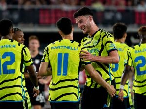Arsenal's Declan Rice celebrates with teammate Gabriel Martinelli after Martinelli scored a goal during a friendly football match between the Major League Soccer (MLS) All-Star team and Arsenal FC, at Audi Field in Washington, DC, on July 19, 2023. (Photo by Stefani Reynolds / AFP)