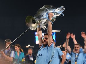 Manchester City's Portuguese midfielder #20 Bernardo Silva celebrates with the European Cup trophy after winning the UEFA Champions League final football match between Inter Milan and Manchester City at the Ataturk Olympic Stadium in Istanbul, on June 10, 2023. (Photo by FRANCK FIFE / AFP)