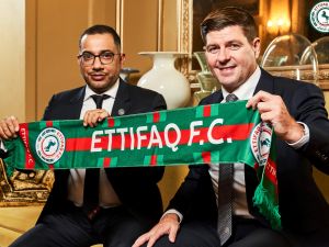 This handout picture released by Saudi Arabia's al-Ettifaq football club on July 3, 2023 shows Ettifaq's new English manager Steven Gerrard (R) with the club's President Khaled al-Debel after signing with them in London. (Photo by Al Ettifaq Football Club / AFP)