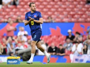 England's striker Harry Kane comes out to warm up ahead of the UEFA Euro 2024 group C qualification football match between England and North Macedonia at Old Trafford in Manchester, north west England, on June 19, 2023. (Photo by Oli SCARFF / AFP)