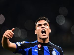 Inter Milan's Argentinian forward Lautaro Martinez celebrates after scoring his side's second goal during the UEFA Champions League quarter-finals second leg football match between Inter Milan and Benfica Lisbon on April 19, 2023 at the Giuseppe-Meazza (San Siro) stadium in Milan. (Photo by GABRIEL BOUYS / AFP)