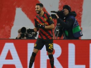 Manchester City's Algerian midfielder Riyad Mahrez celebrates scoring the opening goal during the UEFA Champions League round of 16, first-leg football match between RB Leipzig and Manchester City in Leipzig, eastern Germany on February 22, 2023. (Photo by Odd ANDERSEN / AFP)