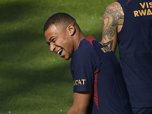 Paris Saint-Germain's French forward Kylian Mbappe reacts as he takes part in a training session at the new "campus" of French L1 Paris Saint-Germain (PSG) football club at Poissy, some 30kms west of Paris on July 20, 2023, ahead of the club's Japan tour. (Photo by JULIEN DE ROSA / AFP)