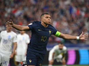 France's forward Kylian Mbappe reacts after scoring the team's first goal during the UEFA Euro 2024 group B qualification football match between France and Greece at the Stade de France in Saint-Denis, in the northern outskirts of Paris, on June 19, 2023. (Photo by FRANCK FIFE / AFP)