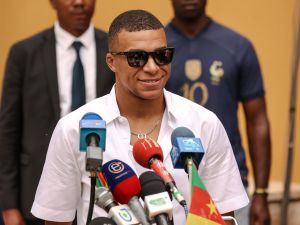 Paris Saint-Germain and France national football team star striker Kylian Mbappe speaks during a press conference in Yaounde on July 7, 2023 during a charity visit and a tour of his father's village. (Photo by Daniel BELOUMOU OLOMO / AFP)