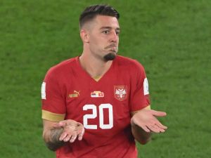 Serbia's midfielder #20 Sergej Milinkovic-Savic reacts after receiving a yellow card during the Qatar 2022 World Cup Group G football match between Serbia and Switzerland at Stadium 974 in Doha on December 2, 2022. (Photo by Patrick T. Fallon / AFP)