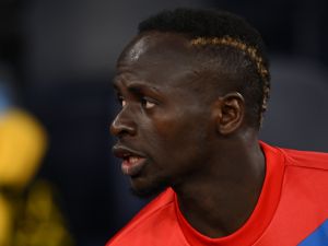 Bayern Munich's Senegalese striker Sadio Mane takes his seat on the bench ahead of kick-off in the UEFA Champions League quarter final, first leg football match between Manchester City and Bayern Munich at the Etihad Stadium in Manchester, north-west England, on April 11, 2023. (Photo by Paul ELLIS / AFP)